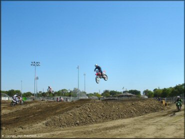 Honda CRF Dirtbike getting air at Los Banos Fairgrounds County Park Track