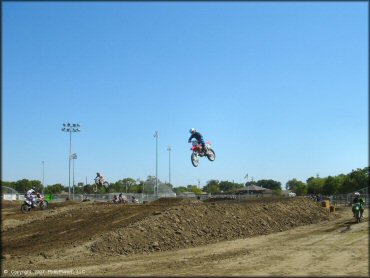 Honda CRF Off-Road Bike catching some air at Los Banos Fairgrounds County Park Track