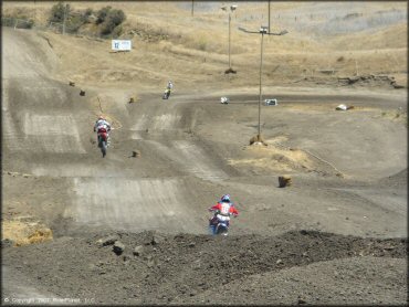 Honda CRF Dirtbike catching some air at Club Moto Track