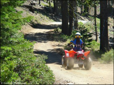 Female rider on a Honda ATV at South Camp Peak Loop Trail