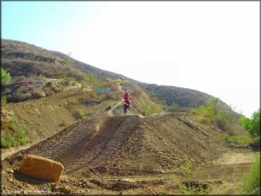 Honda CRF Motorcycle getting air at MX-126 Track