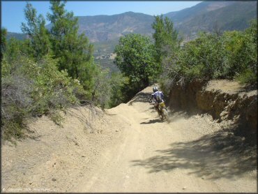 Suzuki dirt bike on offroad trail.