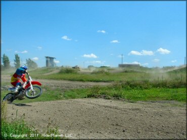 Honda CRF Motorcycle catching some air at Frozen Ocean Motorsports Complex Track