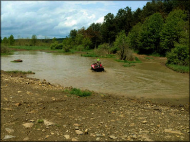 Honda ATV Traveling Crossing a Stream