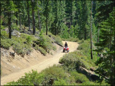 Woman on a Honda Quad at South Camp Peak Loop Trail