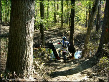 Honda CRF Dirtbike getting wet at Hodges Village Dam Trail