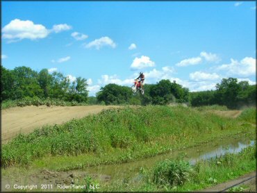 Honda CRF Motorcycle catching some air at Connecticut River MX Track