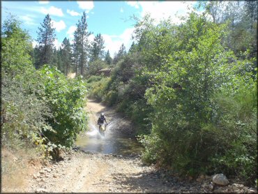 OHV traversing the water at Chappie-Shasta OHV Area Trail