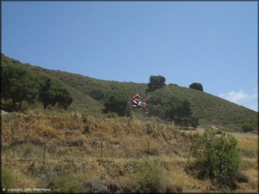 Honda CRF Motorcycle jumping at Hollister Hills SVRA OHV Area