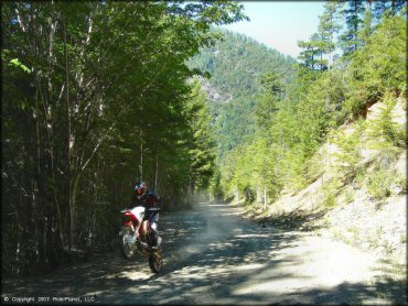Honda CRF Motorcycle doing a wheelie at Rattlesnake Ridge Area Trail