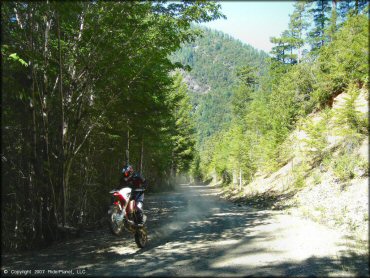 Honda CRF Motorbike doing a wheelie at Rattlesnake Ridge Area Trail