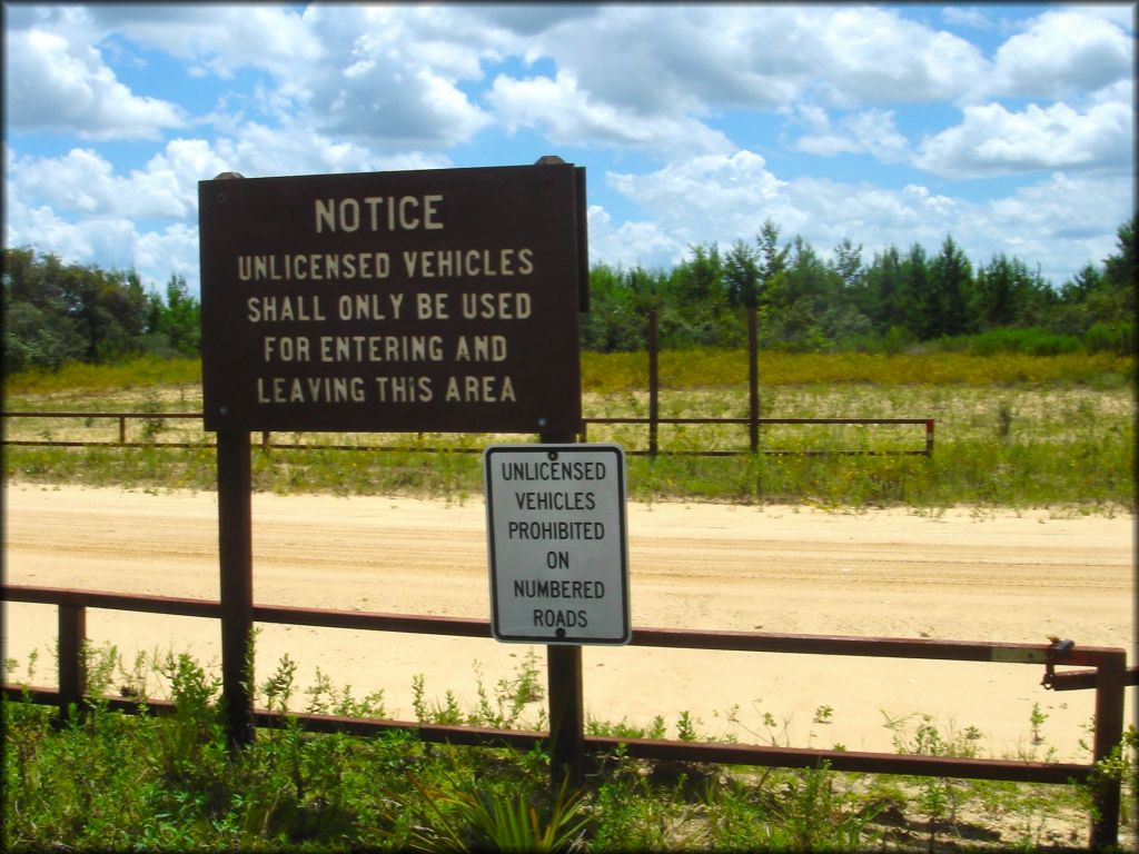 Forest Service signage for vehicle restrictions on main entrance road.