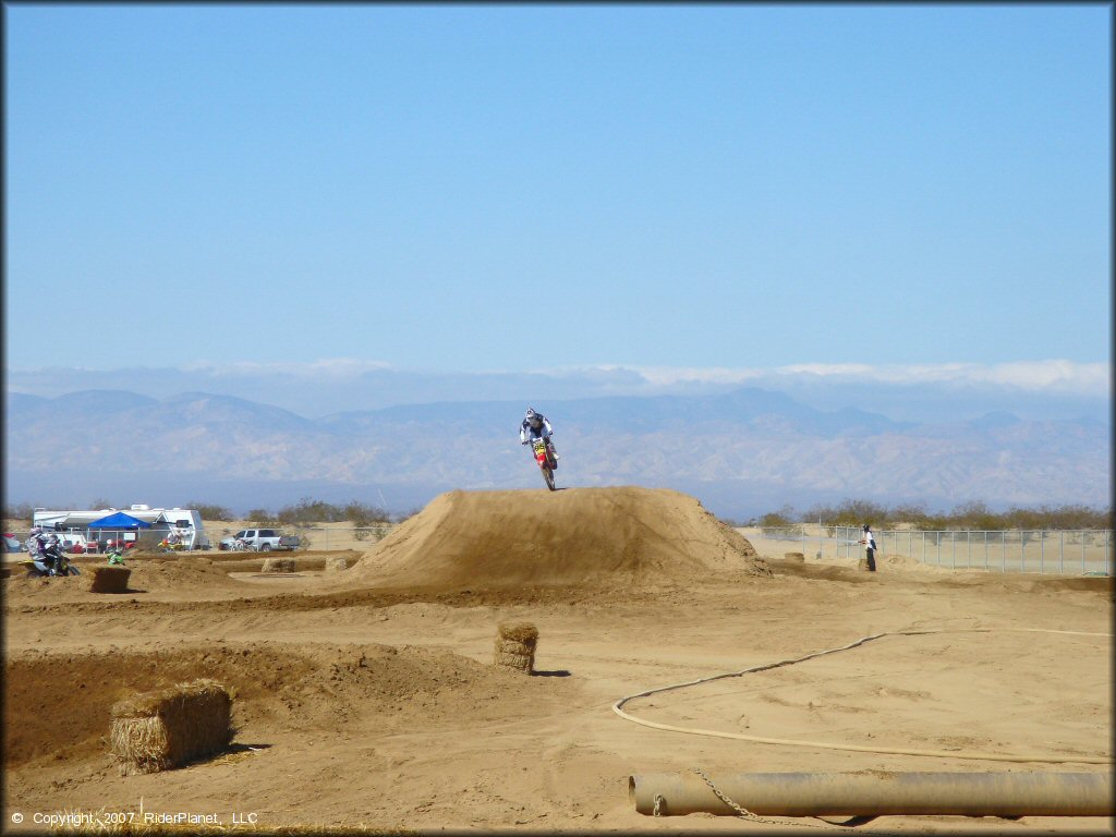 Honda CRF Trail Bike catching some air at Cal City MX Park OHV Area