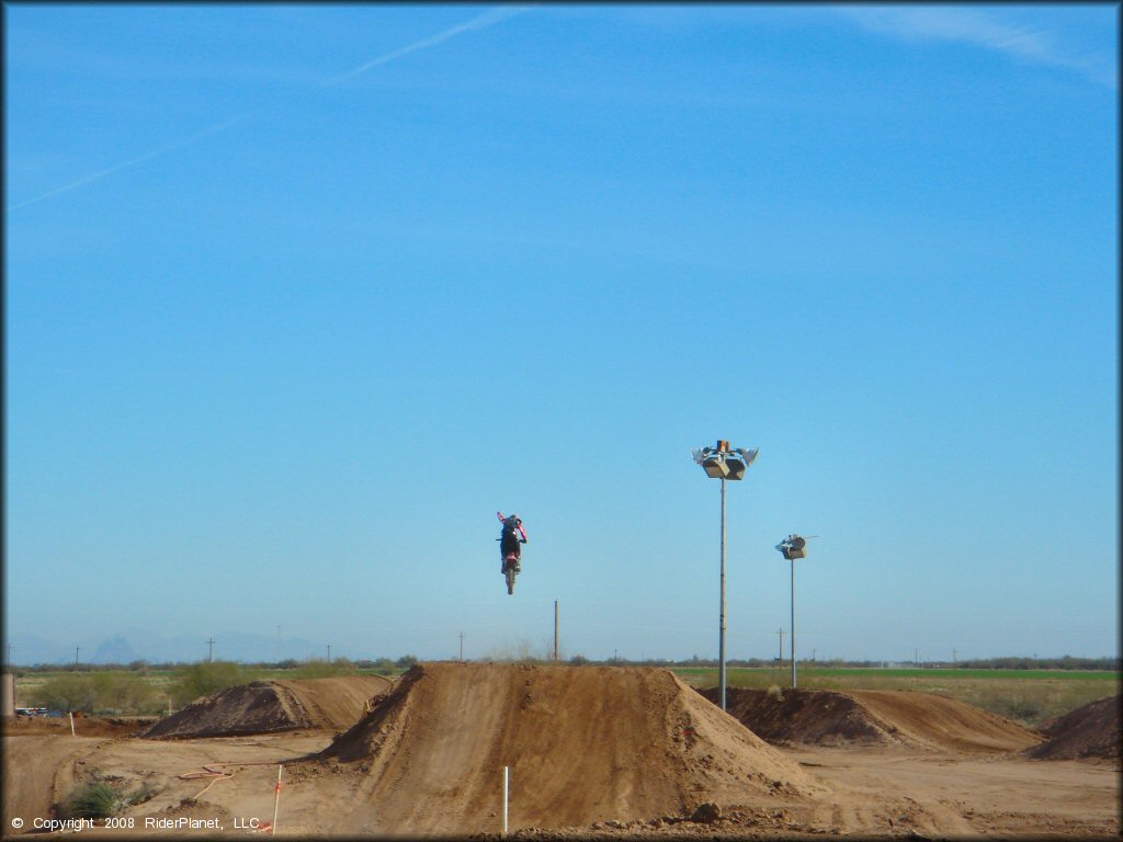 Motorcycle catching some air at Motogrande MX Track