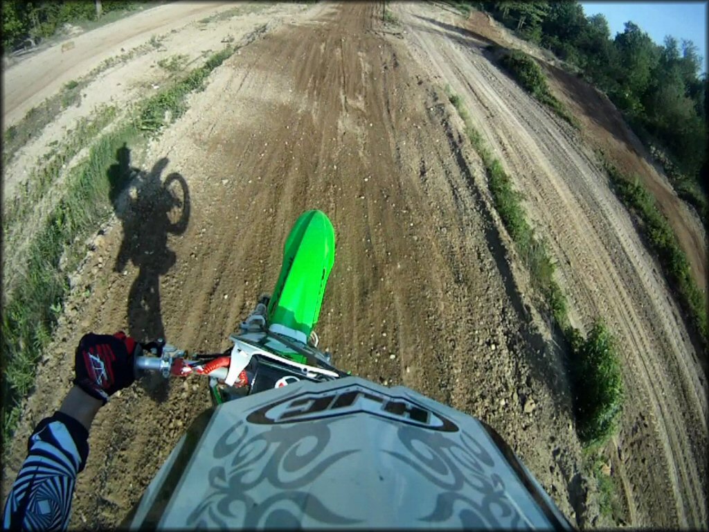 Kawasaki KX Motorcycle jumping at Martin MX Park Track