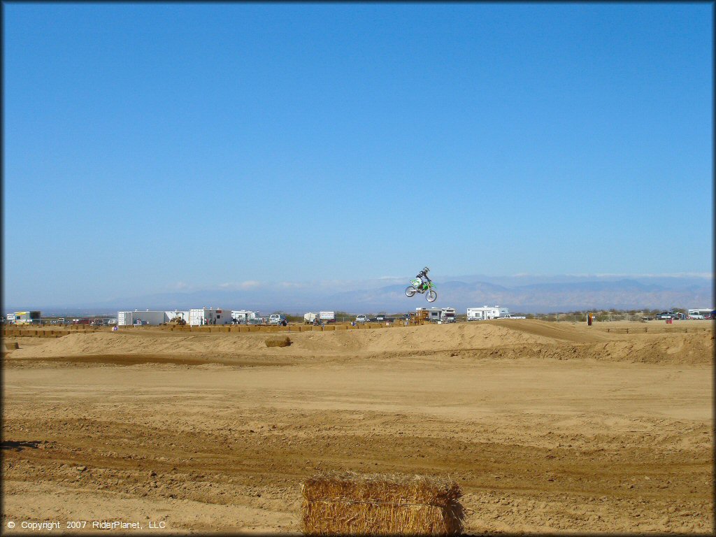Kawasaki KX Motorcycle catching some air at Cal City MX Park OHV Area