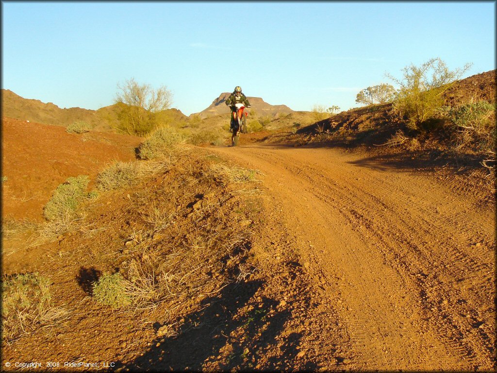 Honda CRF Dirt Bike popping a wheelie at Shea Pit and Osborne Wash Area Trail