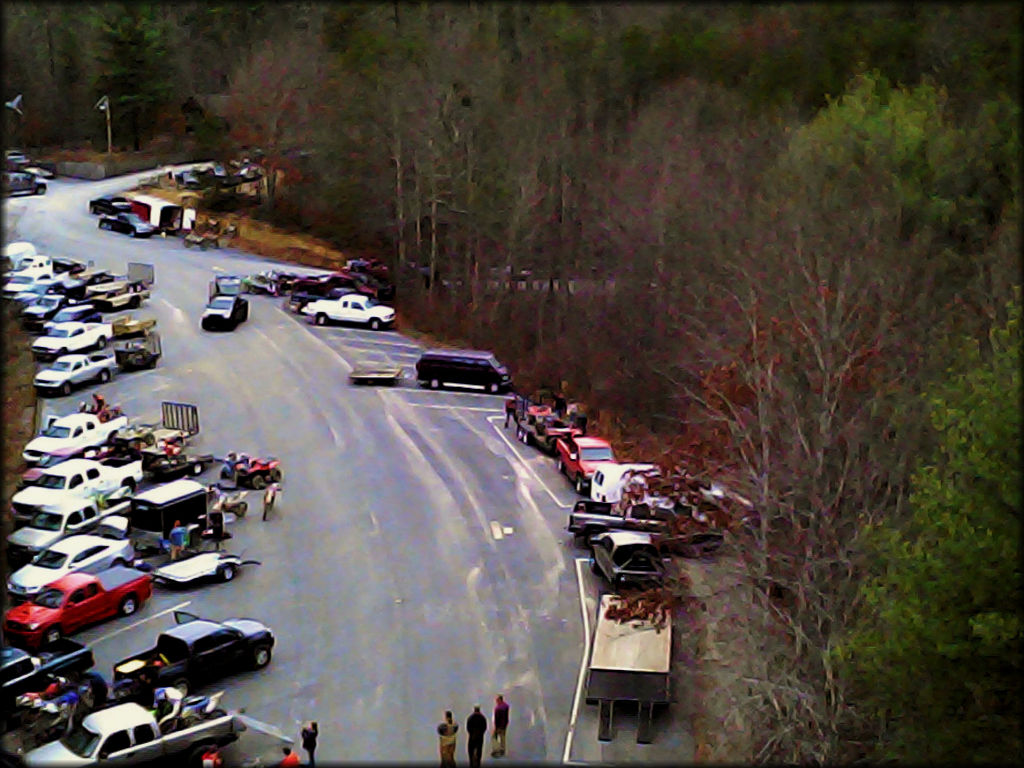 Pickup trucks and trailers parked at staging area.