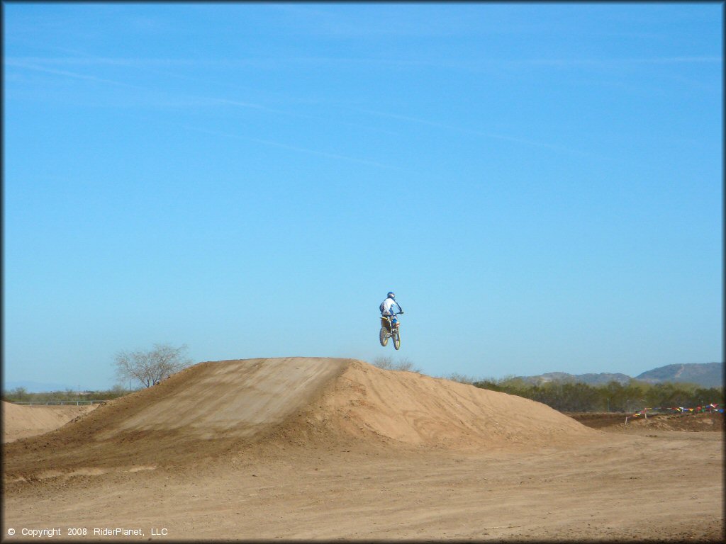 Motorcycle jumping at Motoland MX Park Track