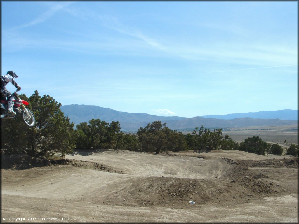 Honda CRF Motorcycle catching some air at Stead MX OHV Area