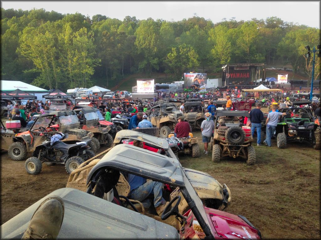 Large group of UTVs waiting for live music concert to start.