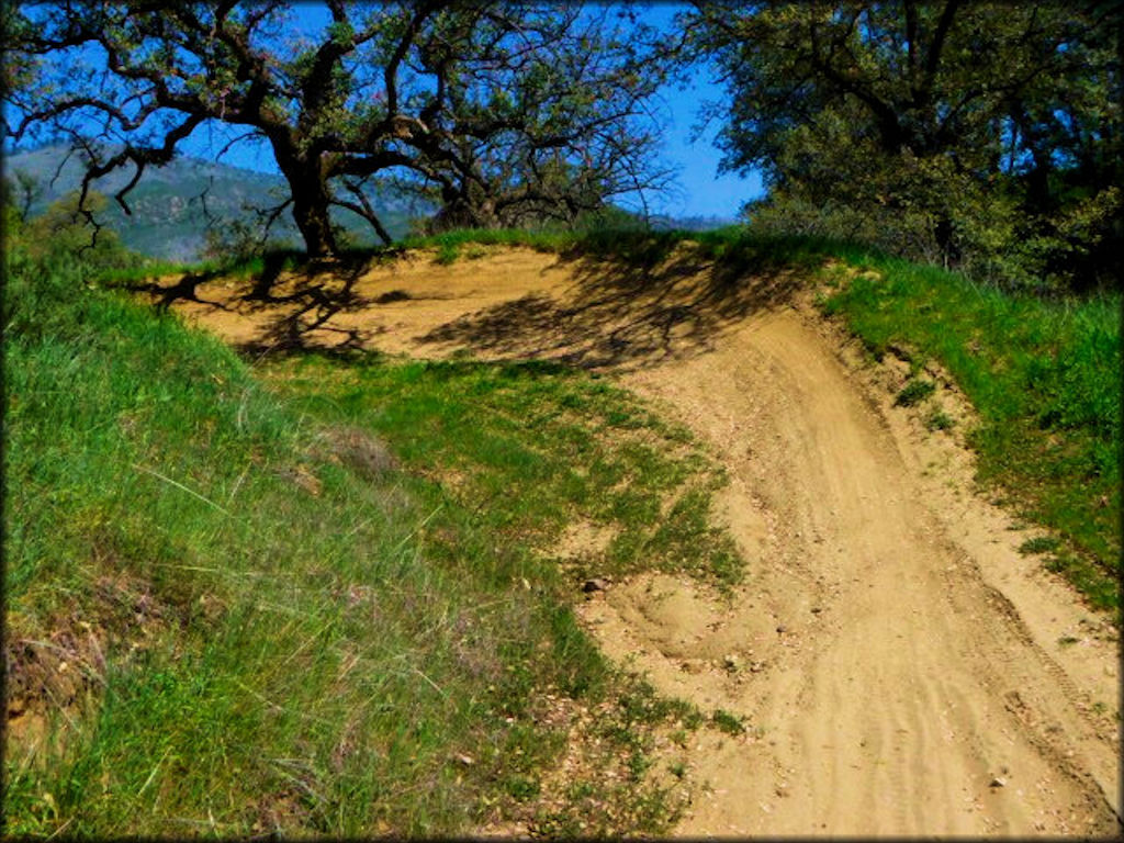Close up view of a sharp turn on a motocross track.