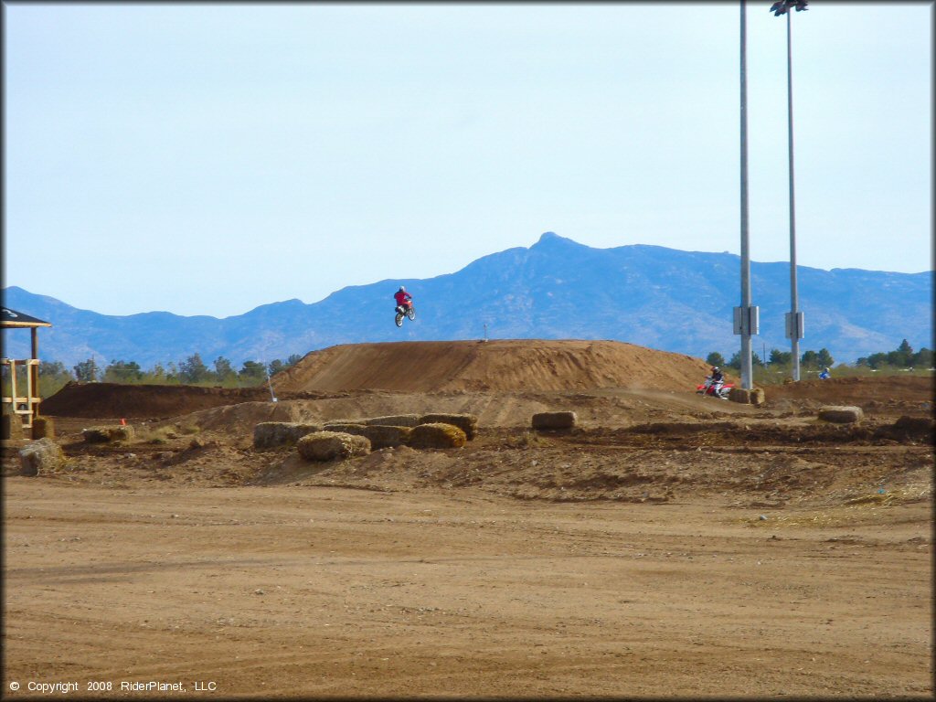 Motorcycle jumping at M.C. Motorsports Park Track