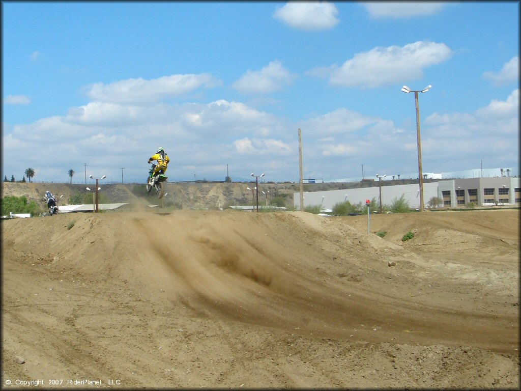 Kawasaki KX Dirt Bike jumping at Milestone Ranch MX Park Track