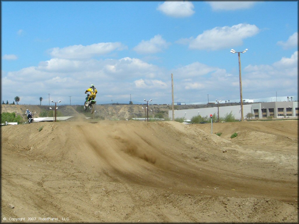 Kawasaki KX Trail Bike catching some air at Milestone Ranch MX Park Track