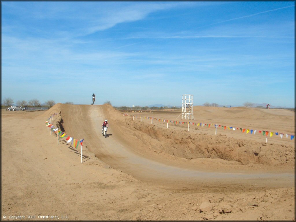 Dirtbike catching some air at Motoland MX Park Track