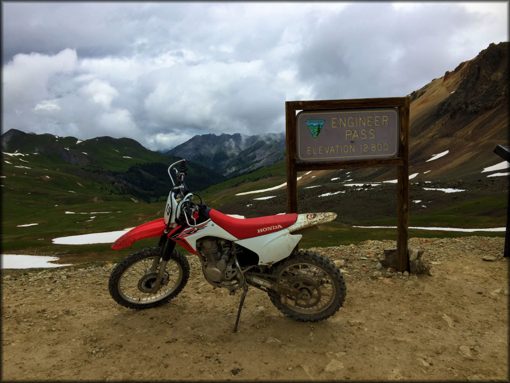 A CRF dirt bike at the top of Engineer Pass in the Colorado Rocky Mountains.