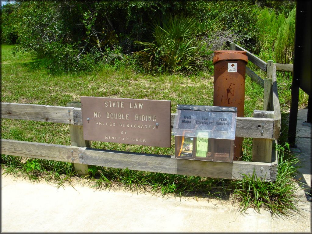 Self pay fee station stocked with permits and paper trail maps.