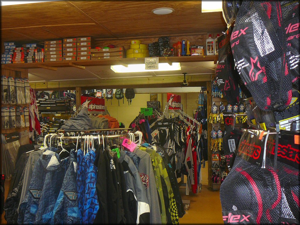 Store photo with knee pads, motocross pants and jerseys, jackets, gloves, sweaters, backpacks and various parts and accessories.