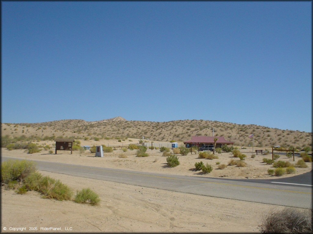 Photo of visitor center taken from intersection of Hwy 14 and Jawbone Canyon Road.