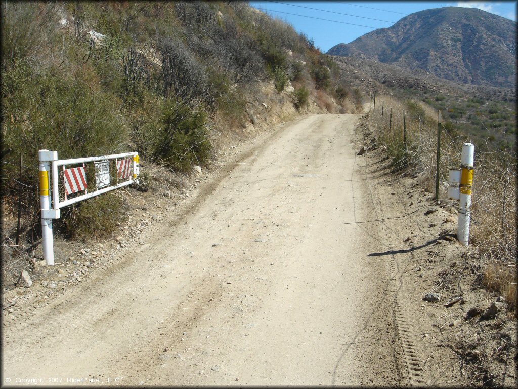 Trail with gate left open on the trail.