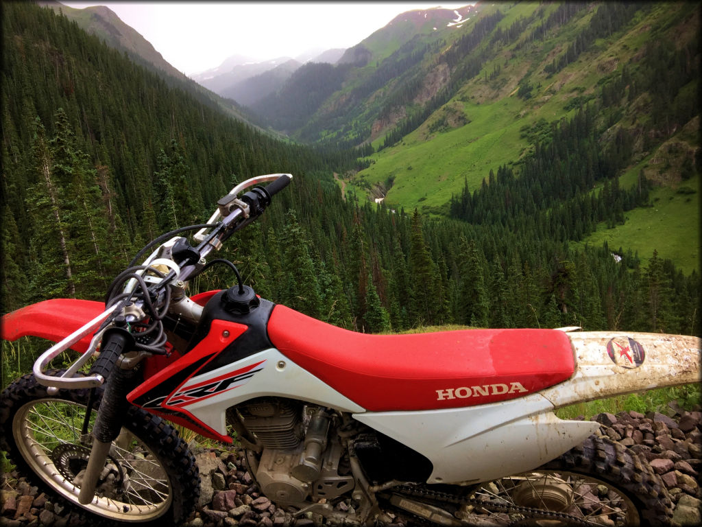 A Honda CRF 230 on a rocky trail.