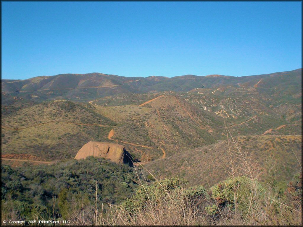 Scenic view of ATV trails going through rolling hills.