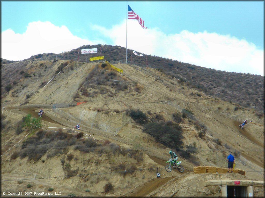 Kawasaki KX Trail Bike catching some air at Glen Helen OHV Area