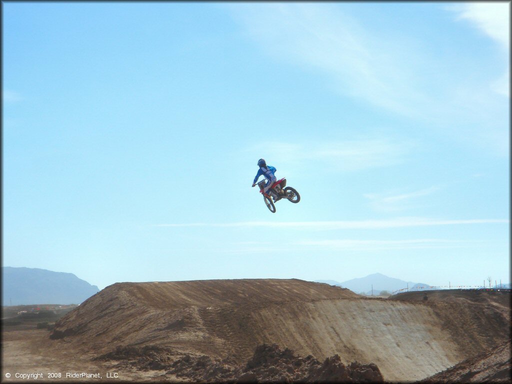 Honda CRF Dirt Bike catching some air at Motoland MX Park Track