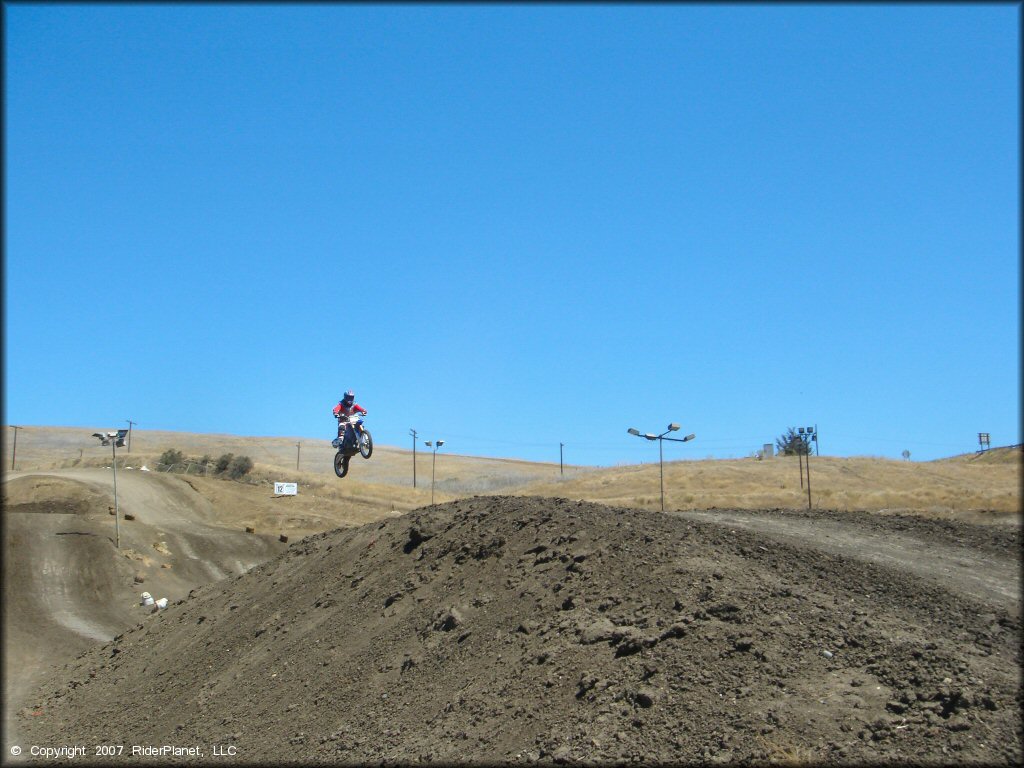 Dirt Bike jumping at Club Moto Track