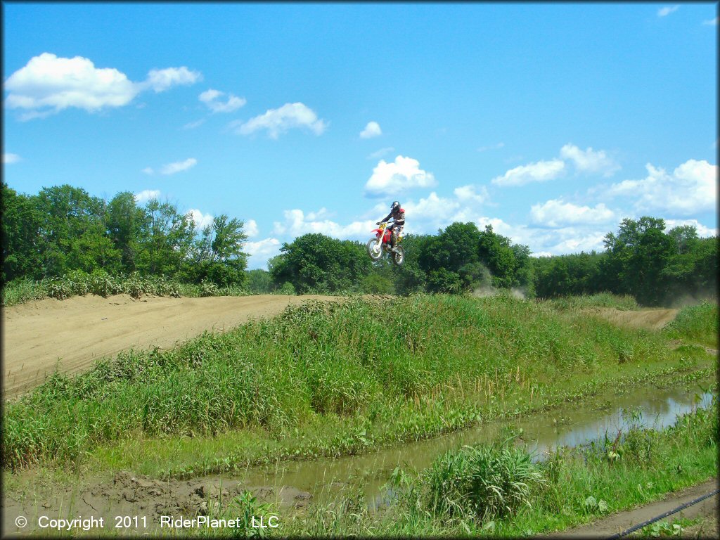 Honda CRF Motorcycle jumping at Connecticut River MX Track