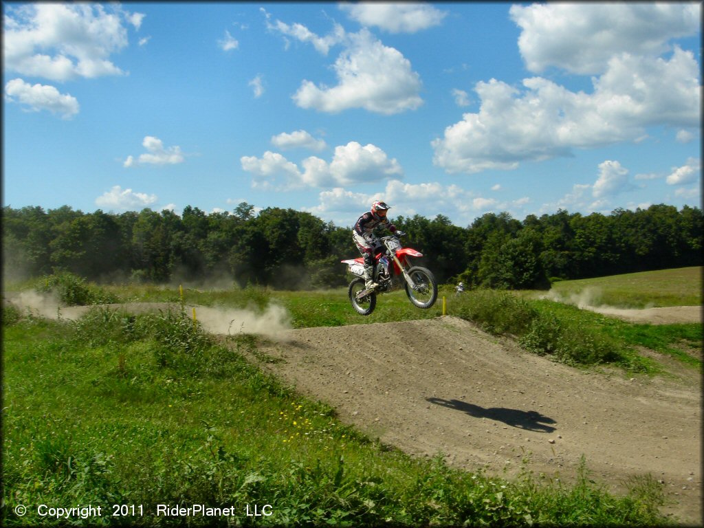 Honda CRF Motorcycle jumping at Frozen Ocean Motorsports Complex Track