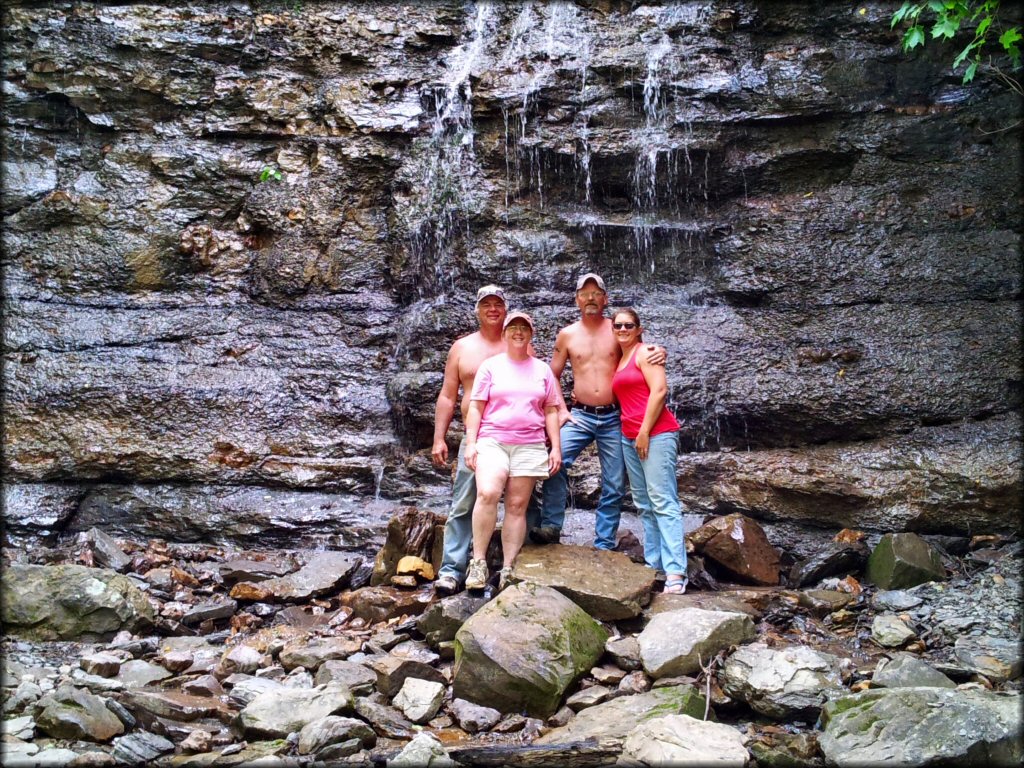 Group photo in front of waterfall.